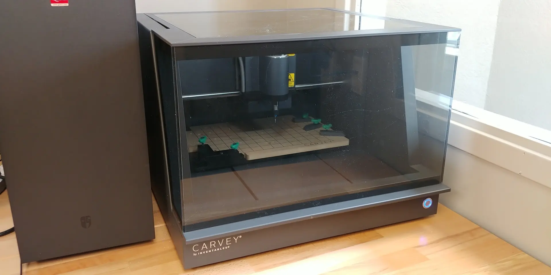 Goodnight Memorial Public Library's CNC Router sitting atop a wooden table.